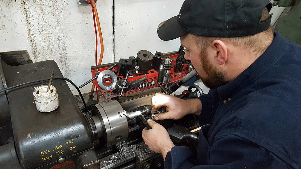 mechanic working on an engine